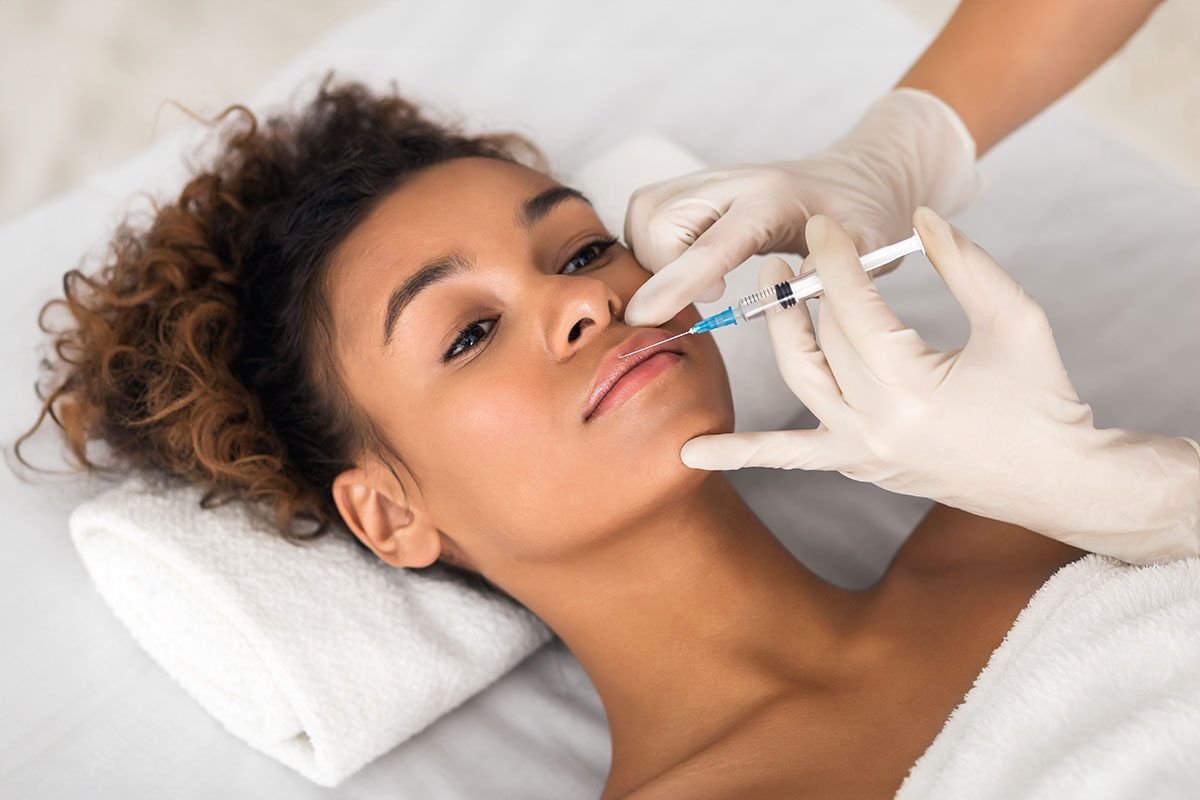 cosmetologist-making-injection-in-female-lips-2026-01-08-23-04-21-utc